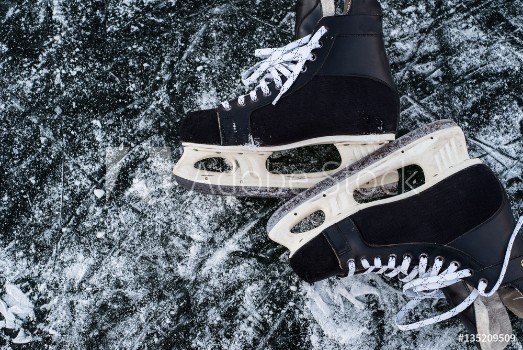 Picture of hockey scates on ice pond riwer